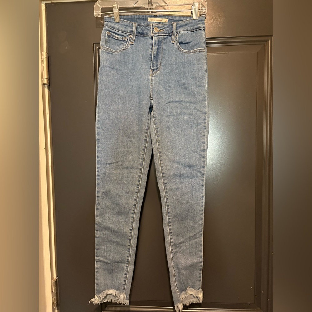 Levi’s 721 high rise skinny with distressed hem